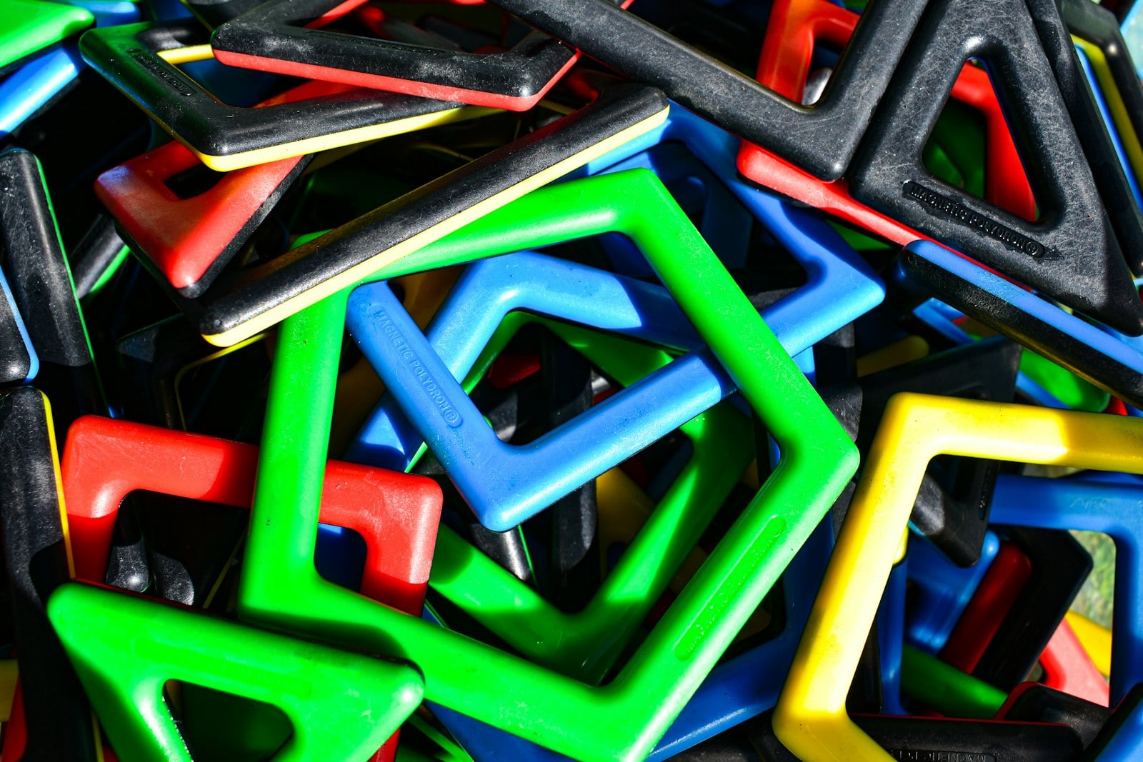 A colorful pile of magnetic building tile toys