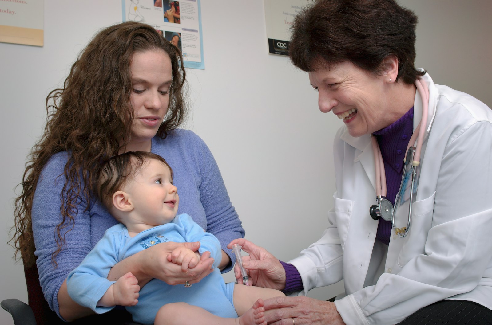 A pediatrician giving a baby a vaccine injection