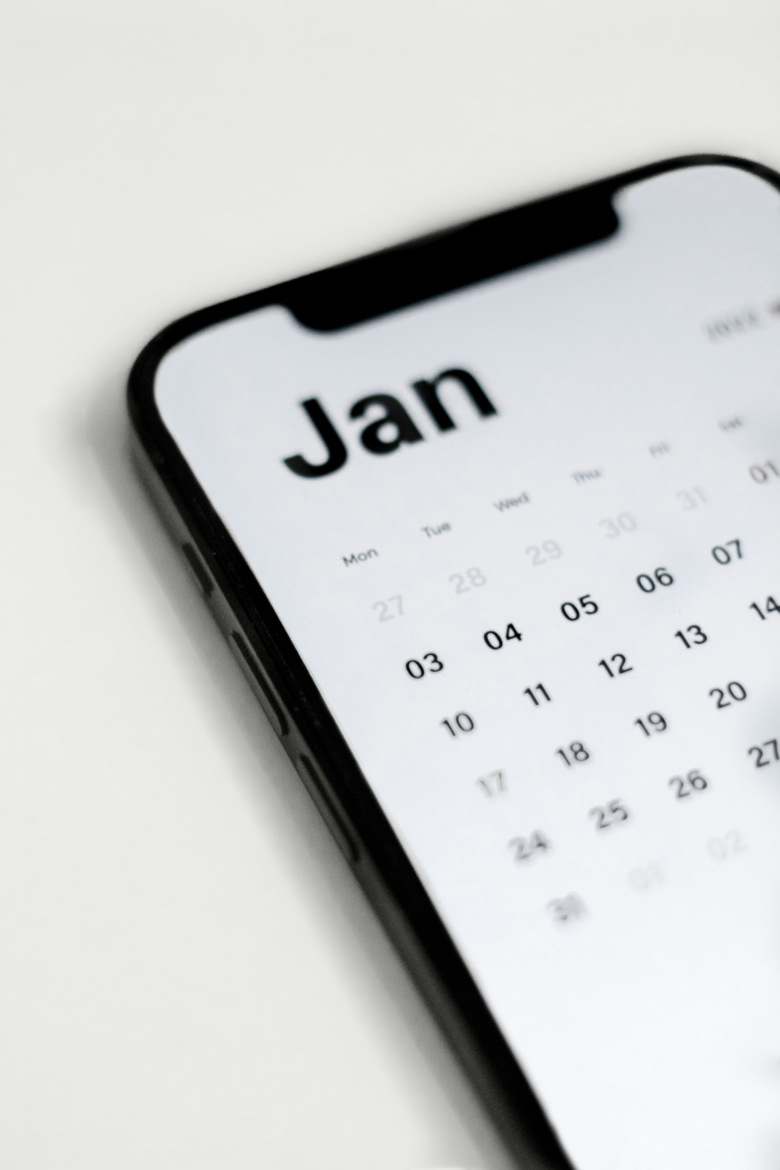 Woman checking a calendar app on her phone