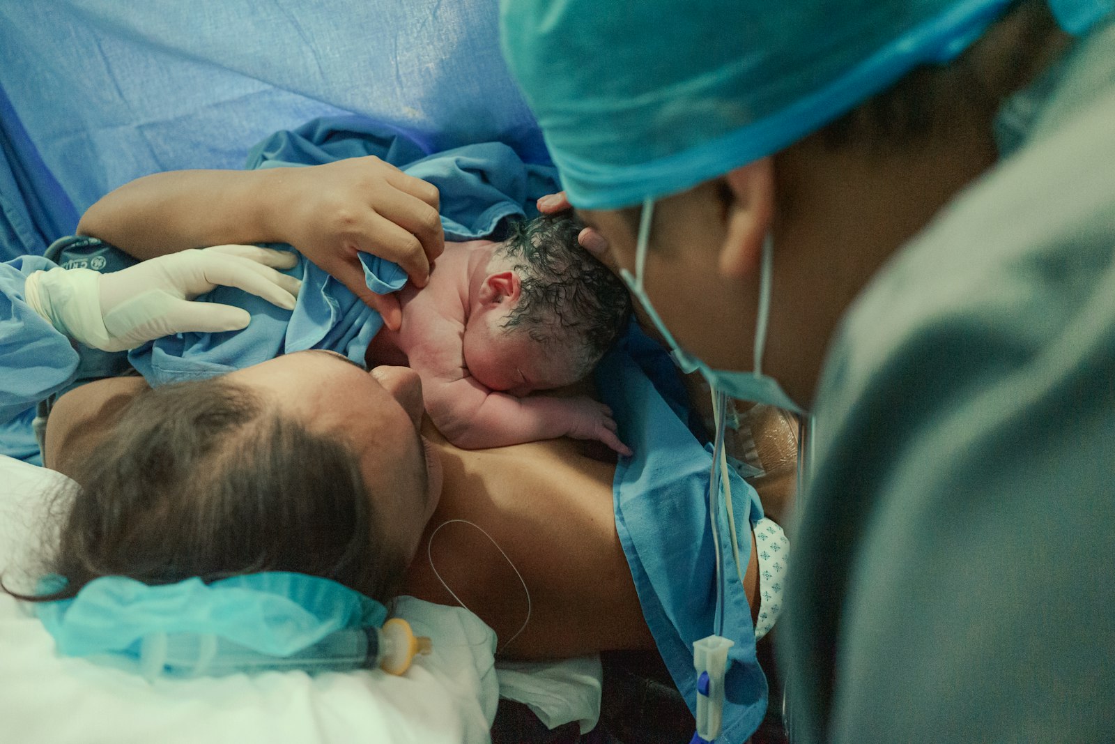 A mother holding her newborn baby shortly after birth